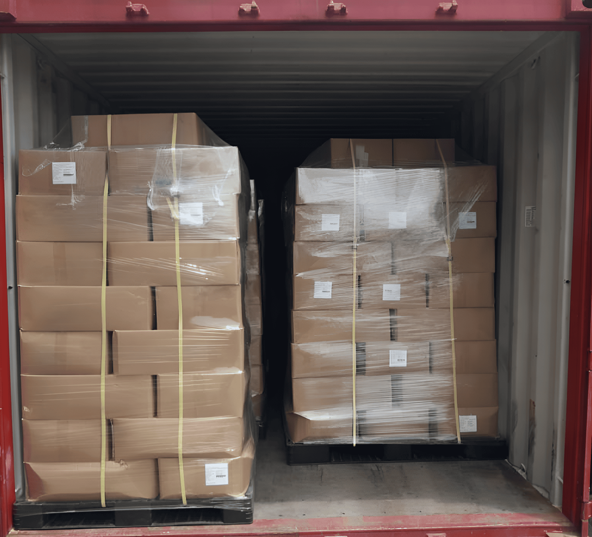 Export cartons secured on pallets inside a shipping container